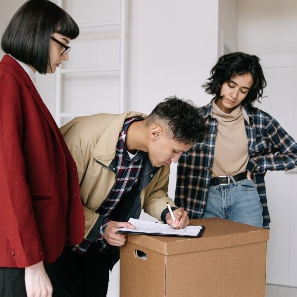 students signing a new lease