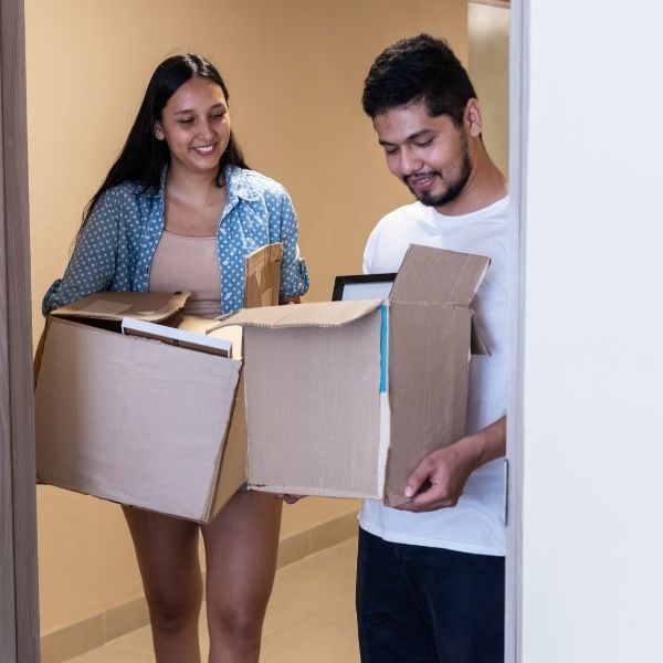 couple moving in with boxes